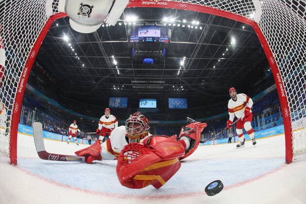 (220210) -- BEIJING, Feb. 10, 2022 -- Goalkeeper Shimisi Jieruimi (front) of China misses a goal during Ice hockey, Eishockey men s Group A match between the United States and China at National Indoor Stadium in Beijing, capital of China, Feb. 10, 2022. (Bruce Bennett Getty Pool via Xinhua) (BEIJING2022)CHINA-BEIJING-OLYMPIC Winter games, Winterspiele,Spiele, Summer games ICE HOCKEY-MEN S PRELIMINARY-U.S. VS CHINA (CN) IOPPxSHARE 