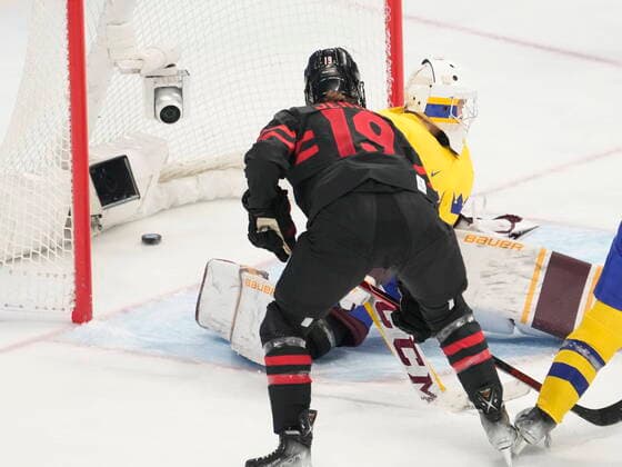 February 11, 2022, Beijing, China: Team Canada forward Brianne Jenner (19) scores past Team Sweden goalkeeper Emma Soderberg (30) during first period women s quarter-final round hockey action at the Beijing Winter Olympics in Beijing, China, on Friday, Feb. 11, 2022. Canada News - February 11, 2022  - ZUMAc35_ 20220211_zaf_c35_071 Copyright: xRyanxRemiorzx