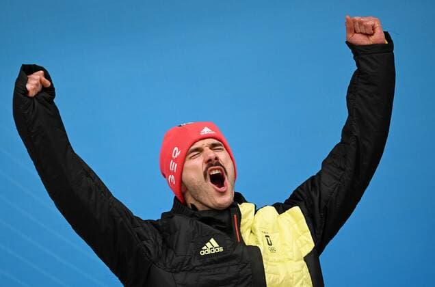 China Olympics 2022 Medal Ceremony 8111657 11.02.2022 Silver medalist Germany s Axel Jungk celebrates on the podium during the medal ceremony for the men s skeleton event of the Beijing 2022 Winter Olympic Games, Olympische Spiele, Olympia, OS at the National Sliding Centre in Yanqing, China. Vladimir Astapkovich Sputnik Yanqing China  Copyright: xVladimirxAstapkovichx