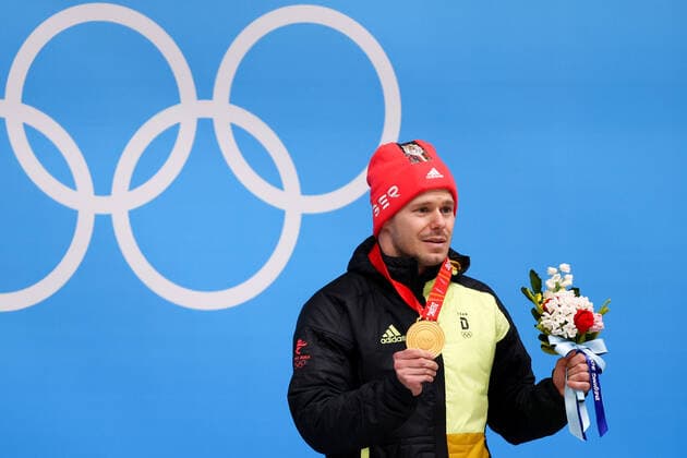 BEIJING, CHINA - FEBRUARY 11, 2022: Gold medalist, Christopher Grotheer of Germany attends an award ceremony for the men s skeleton event at the 2022 Winter Olympics at the Yanqing National Sliding Centre. Anton Novoderezhkin TASS  TS12287B
