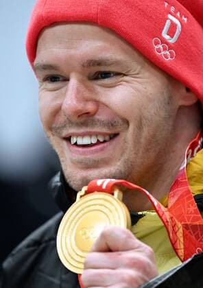 China Olympics 2022 Medal Ceremony 8111669 11.02.2022 Gold medalist Germany s Christopher Grotheer poses during the medal ceremony for the men s skeleton event of the Beijing 2022 Winter Olympic Games, Olympische Spiele, Olympia, OS at the National Sliding Centre in Yanqing, China. Vladimir Astapkovich Sputnik Yanqing China  Copyright: xVladimirxAstapkovichx