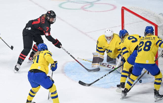 (220211) -- BEIJING, Feb. 11, 2022 -- Laura Stacey (top) of Canada shoots the puck during the Ice hockey, Eishockey women s play-off quarterfinal between Canada and Sweden at Wukesong Sports Centre in Beijing, capital of China, Feb. 11, 2022. ) (BEIJING2022)CHINA-BEIJING-ICE HOCKEY-WOMEN S PLAY-OFF-QUARTERFINAL-CAN VS SWE (CN) HuangxZongzhi 