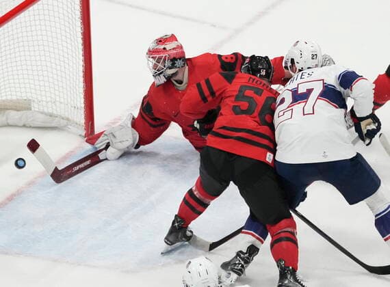 February 12, 2022, Beijing, ON, China: Team Canada goaltender Eddie Pasquale (80) lets in the second goal as Team Canada defender Maxim Noreau (56) and Team United States forward Noah Cates (27) look on during first period menöÄÃ s Ice hockey, Eishockey preliminary action Saturday, February 12, 2022 at the 2022 Winter Olympics in Beijing. Eddie Pasquale, Maxim Noreau,Noah Cates  - ZUMAc35_ 20220212_zaf_c35_033 Copyright: xRyanxRemiorzx