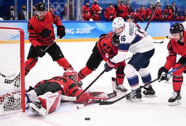 China Olympics 2022 Ice hockey, Eishockey Men Canada - US 8111977 12.02.2022 Canada s goaltender Eddie Pasquale saves the shot attempt by Nick Abruzzese, of the United States, in the men s ice hockey preliminary round group A match between Canada and the United States during the Beijing 2022 Winter Olympic Games, Olympische Spiele, Olympia, OS at National Indoor Stadium in Beijing, China. Alexey Filippov Sputnik Beijing China  Copyright: xAlexeyxFilippovx