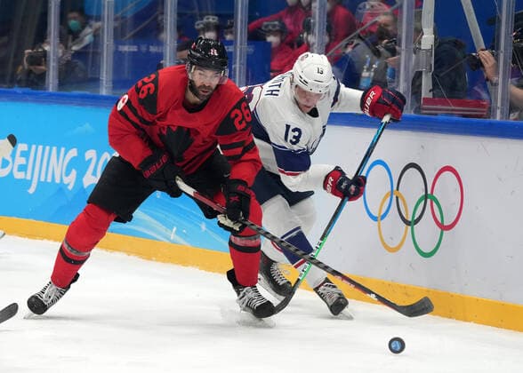BEIJING, CHINA - FEBRUARY 12: Daniel Winnik 26 of Team Canada and Nathan Smith 13 of Team United States compete during the second period of the Men s Ice hockey, Eishockey Preliminary Round Group A match between Team Canada and Team United States on Day 8 of the Beijing 2022 Winter Olympic Games, Olympische Spiele, Olympia, OS at National Indoor Stadium on February 12, 2022 in Beijing, China.  Copyright: xVCGx CFP111368904475 