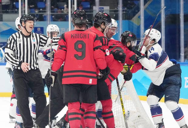 BEIJING, CHINA - FEBRUARY 12: Eric O Dell 19 of Team Canada and Brock Faber 14 of Team United States compete during the second period of the Men s Ice hockey, Eishockey Preliminary Round Group A match between Team Canada and Team United States on Day 8 of the Beijing 2022 Winter Olympic Games, Olympische Spiele, Olympia, OS at National Indoor Stadium on February 12, 2022 in Beijing, China.  Copyright: xVCGx CFP111368904139 