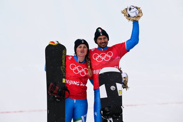 ZHANGJIAKOU, CHINA - FEBRUARY 12: Silver medallists Michela Moioli (L) and Omar Visintin of Team Italy celebrate during the Mixed Team Snowboard Cross Finals flower ceremony on Day 8 of the Beijing 2022 Winter Olympics at Genting Snow Park on February 12, 2022 in Zhangjiakou, Hebei Province of China.  Copyright: xVCGx CFP111368883735 