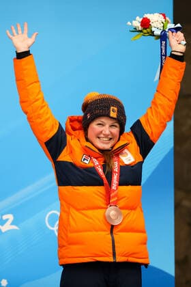 BEIJING, CHINA - FEBRUARY 12, 2022: Bronze medalist, Kimberley Bos of the Netherlands attends an award ceremony for the women s skeleton event at the 2022 Winter Olympic Games, Olympische Spiele, Olympia, OS at the Yanqing National Sliding Centre. Anton Novoderezhkin TASS  TS122C34