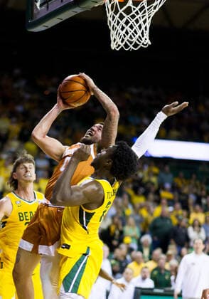 February 12 2022: Texas Longhorns forward Timmy Allen (0) shoots the ball against Baylor Bears forward Jonathan Tchamwa Tchatchoua (23) during the 1st half of the NCAA, College League, USA Basketball game between the Texas Longhorns and Baylor Bears at Ferrell Center in Waco, Texas. CSM Waco US - ZUMAc04_ 20220212_zaf_c04_107 Copyright: xMatthewxLynchx