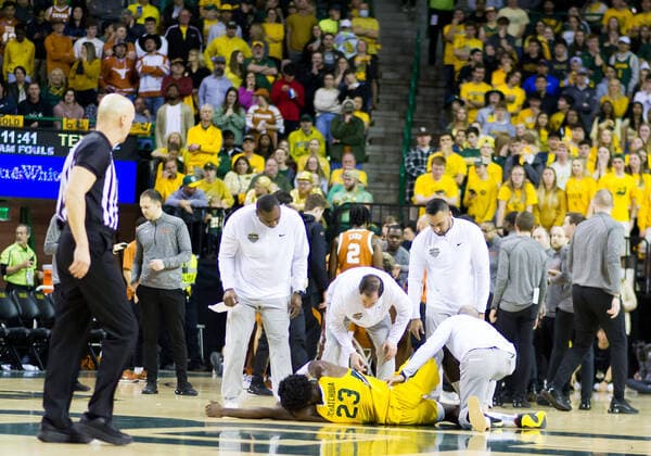 February 12 2022: Baylor Bears head coach SCOTT DREW talks to Baylor Bears forward Jonathan Tchamwa Tchatchoua (23) who is injured during the 1st half of the NCAA, College League, USA Basketball game between the Texas Longhorns and Baylor Bears at Ferrell Center in Waco, Texas. CSM Waco US - ZUMAc04_ 20220212_zaf_c04_108 Copyright: xMatthewxLynchx