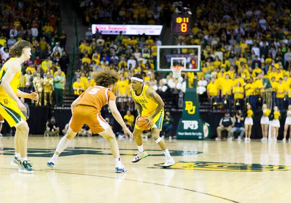 February 12 2022: Baylor Bears guard James Akinjo (11) holds the ball against Texas Longhorns guard Devin Askew (5) during the 2nd half of the NCAA, College League, USA Basketball game between the Texas Longhorns and Baylor Bears at Ferrell Center in Waco, Texas. CSM Waco US - ZUMAc04_ 20220212_zaf_c04_117 Copyright: xMatthewxLynchx