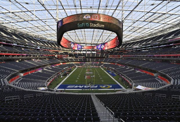 Workers make last-minute preparations on the SoFi Stadium field for Sunday s LVI Super Bowl in Inglewood California on Saturday, February 12, 2022.  LAP2022021201 JIMxRUYMEN