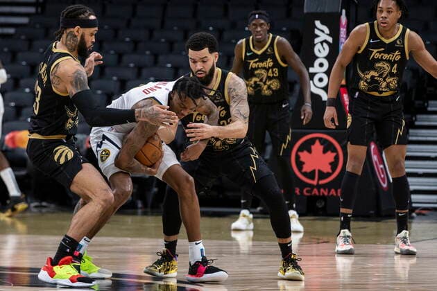 February 12, 2022, Toronto, ON, CANADA: Denver Nuggets Bones Hyland (centre left) battles for the ball with Toronto Raptors Gary Trent Jr. (left) and Fred VanVleet during first half NBA, Basketball Herren, USA basketball action in Toronto on Saturday, February 12, 2022. Bones Hyland; Raptors Gary Trent Jr.; Fred VanVleet  - ZUMAc35_ 20220212_zaf_c35_266 Copyright: xChrisxYoungx
