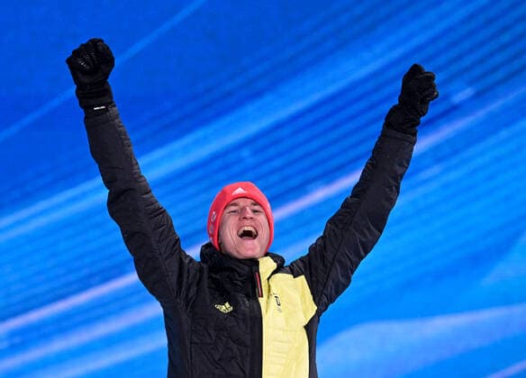 (220213) -- ZHANGJIAKOU, Feb. 13, 2022 -- Bronze medalist Karl Geiger of Germany reacts during the awarding ceremony of Ski jumping, Skispringen, Ski, nordisch men s large hill individual at Zhangjiakou Medals Plaza of the Winter Olympics in Zhangjiakou, north China s Hebei Province, Feb. 13, 2022. ) (BEIJING2022)CHINA- ZHANGJIAKOU-OLYMPIC Winter games, Winterspiele,Spiele, Summer games AWARDING CEREMONY (CN) FengxKaihua