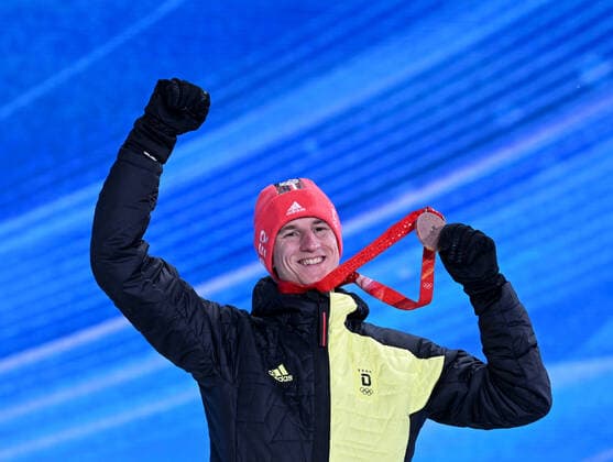(220213) -- ZHANGJIAKOU, Feb. 13, 2022 -- Bronze medalist Karl Geiger of Germany poses during the awarding ceremony of Ski jumping, Skispringen, Ski, nordisch men s large hill individual at Zhangjiakou Medals Plaza of the Winter Olympics in Zhangjiakou, north China s Hebei Province, Feb. 13, 2022. ) (BEIJING2022)CHINA- ZHANGJIAKOU-OLYMPIC Winter games, Winterspiele,Spiele, Summer games AWARDING CEREMONY (CN) FengxKaihua
