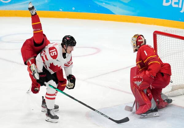 February 13, 2022, Beijing, ON, China: China defender Kailiaosi Jieke (7) gets upended over Canada forward Adam Tambellini (15) during first period men s Ice hockey, Eishockey action at the Beijing Olympic Winter games, Winterspiele,Spiele, Summer games in Beijing, Sunday, Feb. 13, 2022. Canada v. China Men s Olympic Ice Hockey - ZUMAc35_ 20220213_zaf_c35_024 Copyright: xRyanxRemiorzx
