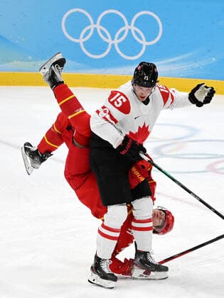 (220213) -- BEIJING, Feb. 13, 2022 -- Adam Tambellini (L) of Canada vies with Zheng Enlai of China during the Ice hockey, Eishockey men s preliminary round Group A match between China and Canada at National Indoor Stadium in Beijing, capital of China, Feb. 13, 2022. ) (BEIJING2022)CHINA-BEIJING-OLYMPIC Winter games, Winterspiele,Spiele, Summer games ICE HOCKEY-MEN S PRELIMINARY-CHN VS CAN(CN) LixZiheng 