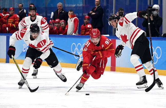 (220213) -- BEIJING, Feb. 13, 2022 -- Wang Taile (2nd R) of China controls the puck during the Ice hockey, Eishockey men s preliminary round Group A match between China and Canada at National Indoor Stadium in Beijing, capital of China, Feb. 13, 2022. ) (BEIJING2022)CHINA-BEIJING-OLYMPIC Winter games, Winterspiele,Spiele, Summer games ICE HOCKEY-MEN S PRELIMINARY-CHN VS CAN(CN) LixAn 