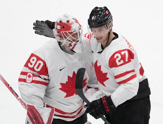 February 13, 2022, Beijing, ON, China: Canada forward Adam Cracknell (27) congratulates Canada goaltender Matt Tomkins (90) at the end of third period men s Ice hockey, Eishockey action against China at the Beijing Olympic Winter games, Winterspiele,Spiele, Summer games in Beijing, Sunday, Feb. 13, 2022. Canada beat China 5-0. Adam Cracknell, Matt Tomkins - ZUMAc35_ 20220213_zaf_c35_054 Copyright: xRyanxRemiorzx