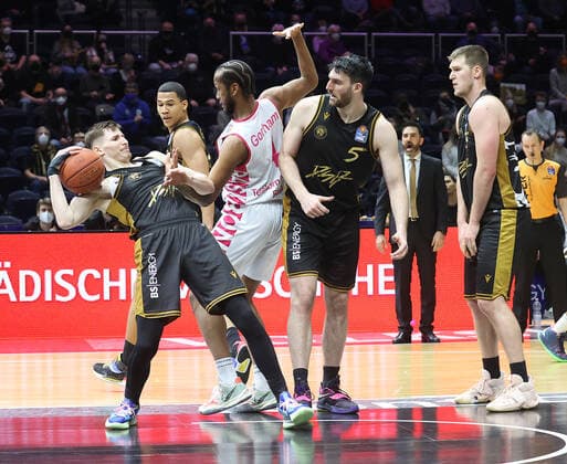 Justin Gorham Telekom Baskets Bonn 4 against David Kraemer Basketball Loewen Braunschweig 1, Owen Klassen Basketball Loewen Braunschweig 5, Martin Peterka Basketball Loewen Braunschweig
