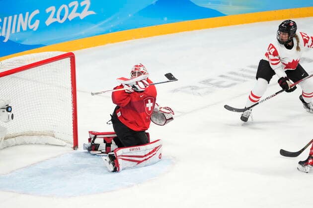 February 14, 2022, Beijing, ON, China: Canada defender Renata Fast (14) scores on Switzerland goaltender Andrea Braendli during first period women s Ice hockey, Eishockey semifinals action Monday, February 14, 2022 at the 2022 Winter Olympics in Beijing. Canada News - February 14, 2022  - ZUMAc35_ 20220214_zaf_c35_017 Copyright: xRyanxRemiorzx