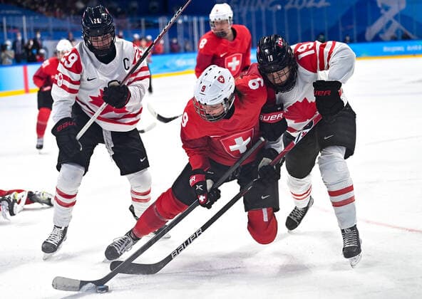 (220214) -- BEIJING, Feb. 14, 2022 -- Shannon Sigrist (C) of Switzerland vies with Brianne Jenner (R) of Canada during the Ice hockey, Eishockey women s semifinal of Beijing 2022 Winter Olympics at Wukesong Sports Centre in Beijing, capital of China, Feb. 14, 2022. ) (BEIJING2022)CHINA-BEIJING-OLYMPIC Winter games, Winterspiele,Spiele, Summer games ICE HOCKEY-SEMIFINAL-CAN VS SUI (CN) SongxYanhua 