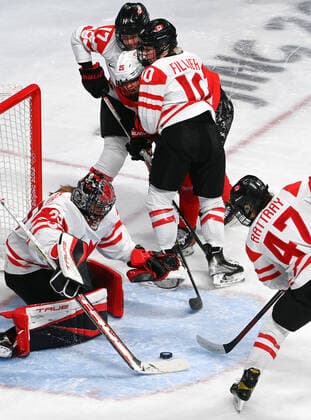 (220214) -- BEIJING, Feb. 14, 2022 -- Athletes of Canada try to make a save during the Ice hockey, Eishockey women s play-off semifinal between Canada and Switzerland at Wukesong Sports Centre in Beijing, capital of China, Feb. 14, 2022. ) (BEIJING2022)CHINA-BEIJING-OLYMPIC Winter games, Winterspiele,Spiele, Summer games ICE HOCKEY-WOMEN S PLAYOFF SEMIFINAL-CANADA VS SWITZERLAND (CN) LiuxXiao 