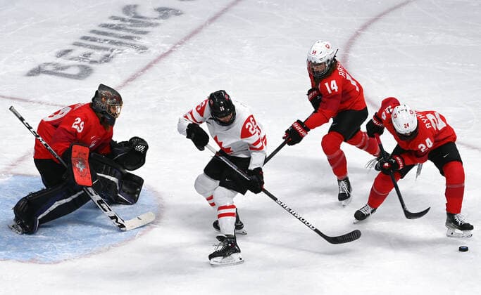 (220214) -- BEIJING, Feb. 14, 2022 -- Noemi Ryhner (1st R) of Switzerland vies with Emily Clark (2nd L) of Canada during the Ice hockey, Eishockey women s play-off semifinal between Canada and Switzerland at Wukesong Sports Centre in Beijing, capital of China, Feb. 14, 2022. ) (BEIJING2022)CHINA-BEIJING-OLYMPIC Winter games, Winterspiele,Spiele, Summer games ICE HOCKEY-WOMEN S PLAYOFF SEMIFINAL-CANADA VS SWITZERLAND (CN) LiuxXiao 