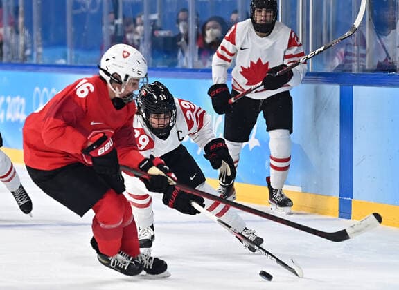(220214) -- BEIJING, Feb. 14, 2022 -- Marie-Philip Poulin (C) of Canada vies with Nicole Vallario of Switzerland during the Ice hockey, Eishockey women s semifinal of Beijing 2022 Winter Olympics at Wukesong Sports Centre in Beijing, capital of China, Feb. 14, 2022. ) (XHTP)(BEIJING2022)CHINA-BEIJING-OLYMPIC Winter games, Winterspiele,Spiele, Summer games ICE HOCKEY-SEMIFINAL-CAN VS SUI (CN) SongxYanhua 