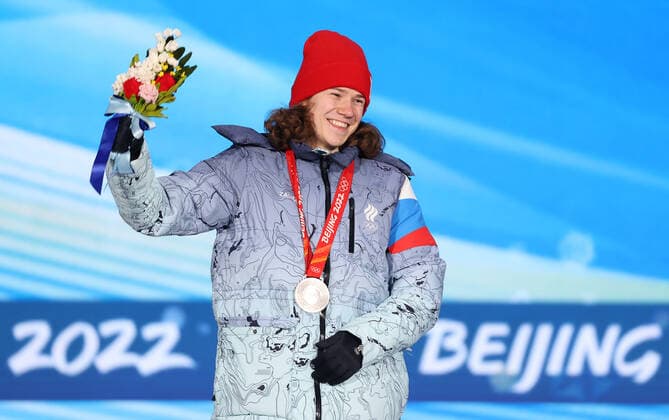 BEIJING, CHINA - FEBRUARY 14, 2022: Silver medalist, ROC athlete Konstantin Ivliyev attends an award ceremony for the men s 500m short track Speed skating, Eisschnelllauf event at the 2022 Winter Olympic Games, Olympische Spiele, Olympia, OS at the Medal Plaza. Anton Novoderezhkin TASS  TS12316A