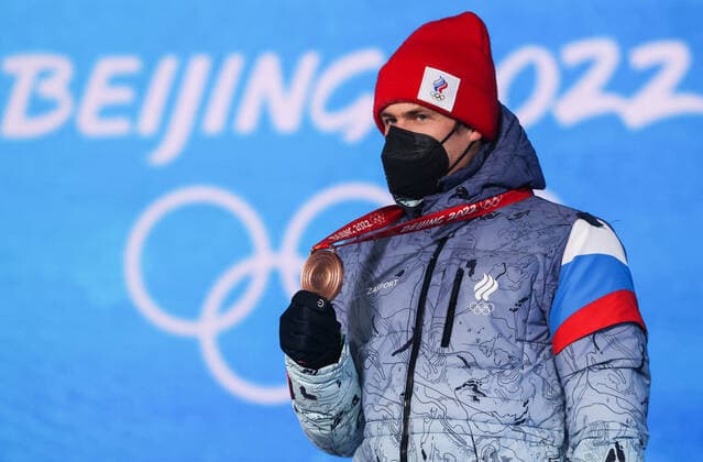 ZHANGJIAKOU, CHINA - FEBRUARY 14, 2022: Bronze medalist, ROC athlete Eduard Latypov attends an award ceremony for the men s 12.5km biathlon pursuit event at the 2022 Winter Olympic Games, Olympische Spiele, Olympia, OS at the Medal Plaza. Sergei Bobylev TASS  TS12316F