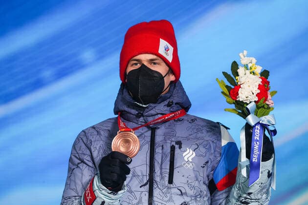 ZHANGJIAKOU, CHINA - FEBRUARY 14, 2022: Bronze medalist, ROC athlete Eduard Latypov attends an award ceremony for the men s 12.5km biathlon pursuit event at the 2022 Winter Olympic Games, Olympische Spiele, Olympia, OS at the Medal Plaza. Sergei Bobylev TASS  TS123170