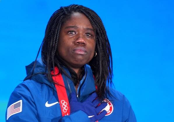 China Olympics 2022 Medal Ceremony 8114412 14.02.2022 Gold medalist Erin Jackson, of the United States, listens to national anthem during the medal ceremony for the Speed skating, Eisschnelllauf women s 500 m event of the Beijing 2022 Winter Olympic Games, Olympische Spiele, Olympia, OS at the Medals Plaza in Beijing, China. Alexander Vilf Sputnik Beijing China  Copyright: xAlexanderxVilfx