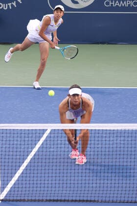 Zhang Shuai, CHN cap, full white , and Ena Shibahara, JPN, during first round doubles of 2022 Dubai Championships in Dubai, 14 02 2022