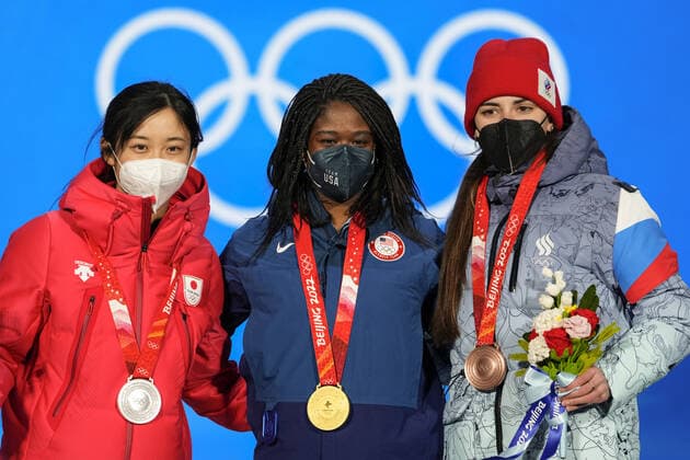Gold medalist Erin Jackson of the U.S. (C) stands with silver medalist Miho Takagi of Japan (L) and bronze medalist Angelina Golikova of ROC during the medals ceremony for the Women s Speed skating, Eisschnelllauf 500 meter race at the Beijing 2022 Winter Olympics on Monday, February 14, 2022.  OLY20220214307 PaulxHanna