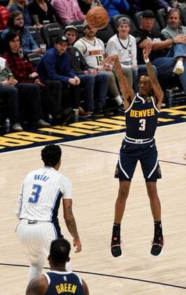 Denver Nuggets guard Bones Hyland (R) shoots a three point shot as Orlando Magic forward Chuma Okeke looks on, during a NBA, Basketball Herren, USA game at the Ball Arena in Denver, CO, USA, 14 February 2022. Orlando Magic at Denver Nuggets !ACHTUNG: NUR REDAKTIONELLE NUTZUNG!  Copyright: xToddxPiersonx AME5760 20220215-7b8eccc966e0521dc6d82e55f0b53798077cf7f4