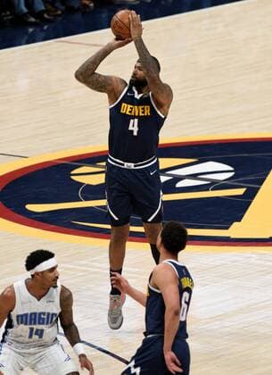 Denver Nuggets center DeMarcus Cousins (up) goes up for a three point shot against Orlando Magic guard Gary Harris (L), during a NBA, Basketball Herren, USA game at the Ball Arena in Denver, CO, USA, 14 February 2022. Orlando Magic at Denver Nuggets !ACHTUNG: NUR REDAKTIONELLE NUTZUNG!  Copyright: xToddxPiersonx AME5767 20220215-2293de02e284eece6e2e7b78c8257938a55a9d85