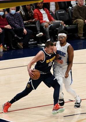 Denver Nuggets center Nikola Jokic (L) fights off Orlando Magic center Wendell Carter Jr, during a NBA, Basketball Herren, USA game at the Ball Arena in Denver, CO, USA, 14 February 2022. Orlando Magic at Denver Nuggets !ACHTUNG: NUR REDAKTIONELLE NUTZUNG!  Copyright: xToddxPiersonx AME5765 20220215-93396ddd5fe655c26560806a17daaafc5b33343a