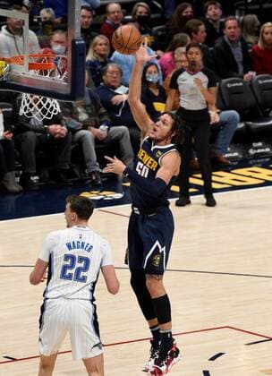 Denver Nuggets forward Aaron Gordon (R) goes up for a shot over the head of Orlando Magic forward Franz Wagner, during a NBA, Basketball Herren, USA game at the Ball Arena in Denver, CO, USA, 14 February 2022. Orlando Magic at Denver Nuggets !ACHTUNG: NUR REDAKTIONELLE NUTZUNG!  Copyright: xToddxPiersonx AME5764 20220215-8c667549ceeb4ac7bd74fedc55072e5c68d4a5c4