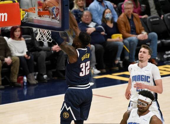 Denver Nuggets forward Jeff Green (up) goes in for the dunk against Orlando Magic center Wendell Carter Jr (C), during a NBA, Basketball Herren, USA game at the Ball Arena in Denver, CO, USA, 14 February 2022. Orlando Magic at Denver Nuggets !ACHTUNG: NUR REDAKTIONELLE NUTZUNG!  Copyright: xToddxPiersonx AME5763 20220215-9006463012a2954386a0c8ac0fca3e9722d07ae9