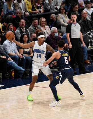 Orlando Magic guard Gary Harris (L) looks for an open man while fighting off Denver Nuggets guard Bryn Forbes, during a NBA, Basketball Herren, USA game at the Ball Arena in Denver, CO, USA, 14 February 2022. Orlando Magic at Denver Nuggets !ACHTUNG: NUR REDAKTIONELLE NUTZUNG!  Copyright: xToddxPiersonx AME5768 20220215-fac24ea8f7f253dbe17961dc79f8862b26341869