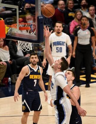 Orlando Magic forward Franz Wagner (2-R) goes in for a basket against Denver Nuggets center Nikola Jokic (R), during a NBA, Basketball Herren, USA game at the Ball Arena in Denver, CO, USA, 14 February 2022. Orlando Magic at Denver Nuggets !ACHTUNG: NUR REDAKTIONELLE NUTZUNG!  Copyright: xToddxPiersonx AME5790 20220215-2fcf5c476ce1471f3b2b79e5bb624b22fe6746ac