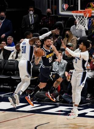 Denver Nuggets guard Austin Rivers in action against Orlando Magic guard Terrence Ross (L) and forward Chuma Okeke (R), during a NBA, Basketball Herren, USA game at the Ball Arena in Denver, CO, USA, 14 February 2022. Orlando Magic at Denver Nuggets !ACHTUNG: NUR REDAKTIONELLE NUTZUNG!  Copyright: xToddxPiersonx AME5791 20220215-270a11a15fa91d583e53d14443ef41c61ddc2090