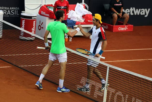 (220215) -- BRAZIL, Feb. 15, 2022 -- Shang Juncheng (R) of China shakes hands with Pedro Martinez Portero of Spain during the first round of Rio Open between Shang Juncheng of China and Pedro Martinez Portero of Spain in Rio de Janeiro, Brazil, Feb. 14, 2022. ) (SP)BRAZIL-RIO DE JANEIRO-TENNIS-RIO OPEN-1ST ROUND WangxTiancong 