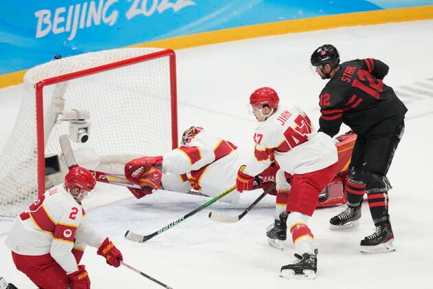 February 15, 2022, Beijing, China: Team Canada forward Eric Staal (12) looks on as a shot by teammate Jordan Weal (not shown) eludes Team China goaltender Jeremy Smith for a goal during first period men s qualification round hockey action at the Beijing Winter Olympics in Beijing, China, on Tuesday, Feb. 15, 2022. Canada News - February 15, 2022  - ZUMAc35_ 20220215_zaf_c35_110 Copyright: xRyanxRemiorzx