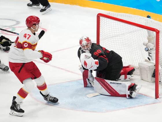 February 15, 2022, Beijing, China: Team China forward An Jian (47) scores past Team Canada goaltender Matt Tomkins (90) during first period men s qualification round hockey action at the Beijing Winter Olympics in Beijing, China, on Tuesday, Feb. 15, 2022. Canada News - February 15, 2022  - ZUMAc35_ 20220215_zaf_c35_115 Copyright: xRyanxRemiorzx