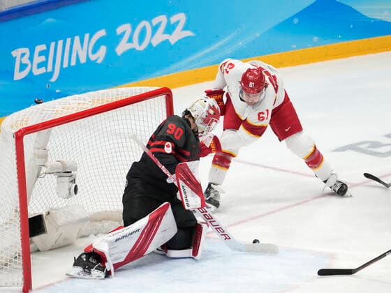 February 15, 2022, Beijing, China: Team Canada goaltender Matt Tomkins (90) stops Team China forward Ruike Wei (61) during second period men s qualification round hockey action at the Beijing Winter Olympics in Beijing, China, on Tuesday, Feb. 15, 2022. Canada News - February 15, 2022  - ZUMAc35_ 20220215_zaf_c35_118 Copyright: xRyanxRemiorzx