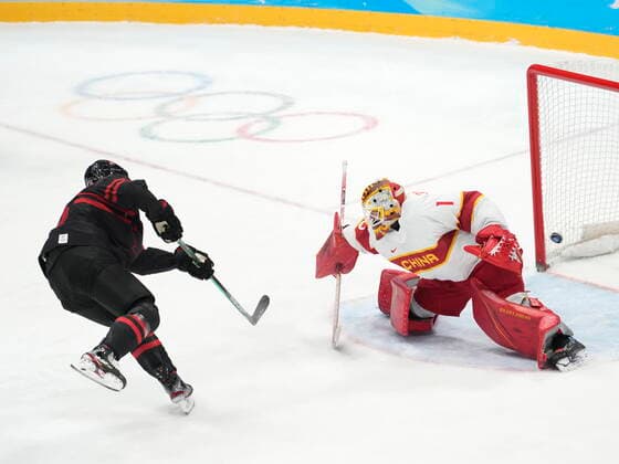 February 15, 2022, Beijing, China: Team Canada forward Adam Tambellini (15) scores on a penalty shot past Team China goaltender Paris O Brien during second period men s qualification round hockey action at the Beijing Winter Olympics in Beijing, China, on Tuesday, Feb. 15, 2022. Canada News - February 15, 2022  - ZUMAc35_ 20220215_zaf_c35_121 Copyright: xRyanxRemiorzx