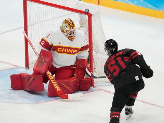 February 15, 2022, Beijing, China: Team Canada forward David Desharnais (51) shoots on Team China goaltender Paris O Brien during second period men s qualification round hockey action at the Beijing Winter Olympics in Beijing, China, on Tuesday, Feb. 15, 2022. Canada News - February 15, 2022  - ZUMAc35_ 20220215_zaf_c35_119 Copyright: xRyanxRemiorzx