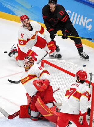 (220215) -- BEIJING, Feb. 15, 2022 -- Goalkeeper Shimisi Jieruimi (front, L) of China makes a save during the Ice hockey, Eishockey men s qualification play-off of Beijing 2022 Winter Olympics between Canada and China at Wukesong Sports Centre, in Beijing, capital of China, Feb. 15, 2022. ) (BEIJING2022)CHINA-BEIJING-OLYMPIC Winter games, Winterspiele,Spiele, Summer games ICE HOCKEY-MEN S QUALIFICATION PLAY-OFF-CAN VS CHN (CN) LixZiheng 